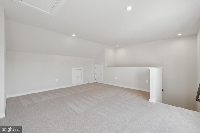 additional living space with lofted ceiling and light colored carpet