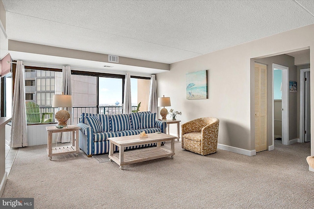 living room with carpet flooring and a textured ceiling