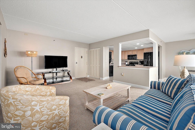 carpeted living room featuring a textured ceiling