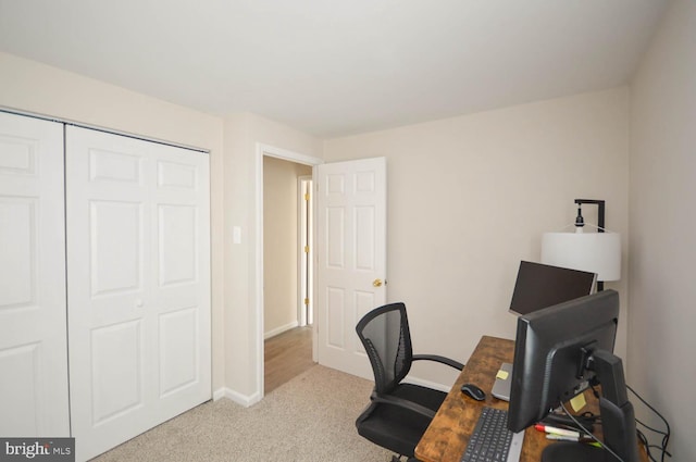 office with light colored carpet and baseboards