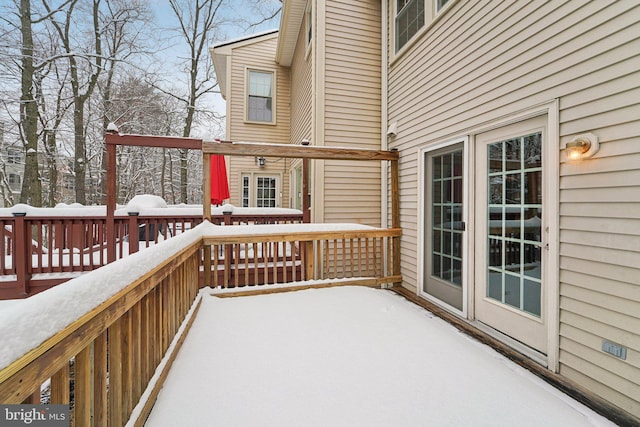 view of snow covered deck