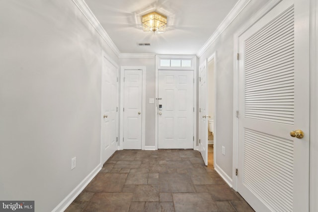 foyer entrance featuring ornamental molding