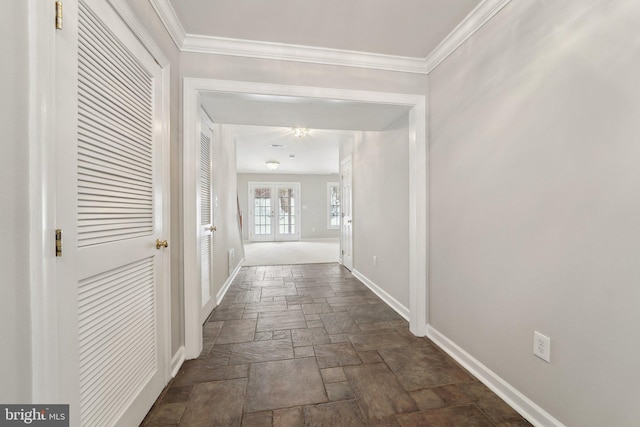 hall featuring french doors and ornamental molding