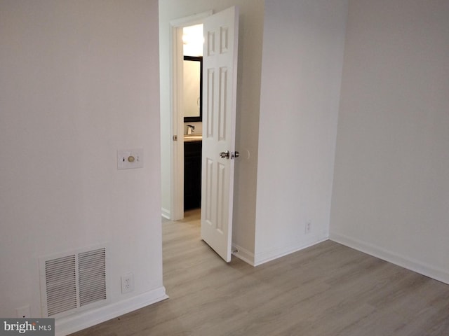 spare room with light hardwood / wood-style floors