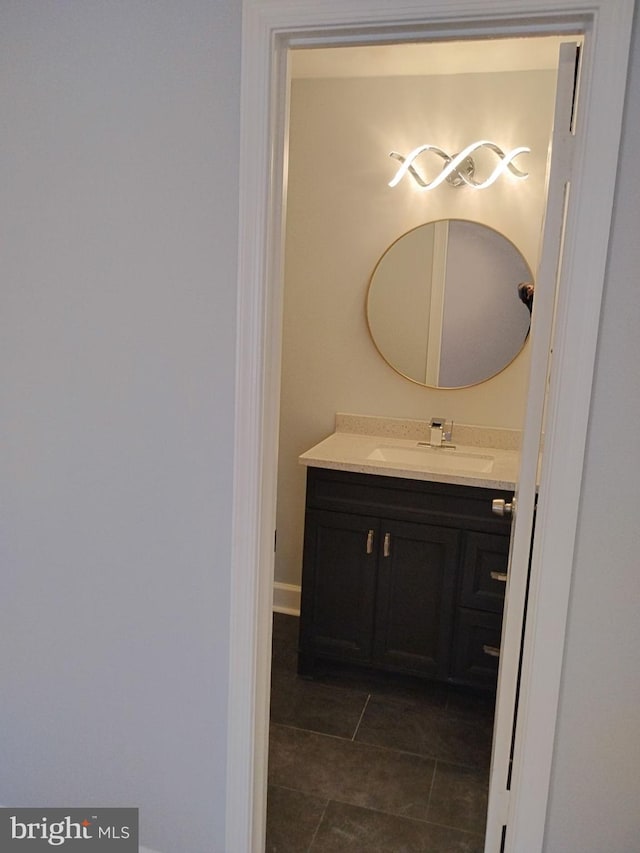 bathroom featuring vanity and tile patterned flooring