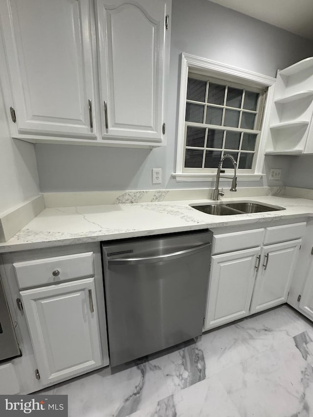 kitchen featuring sink, light stone countertops, white cabinets, and dishwasher