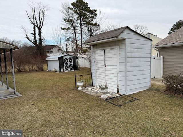 view of outbuilding featuring a yard