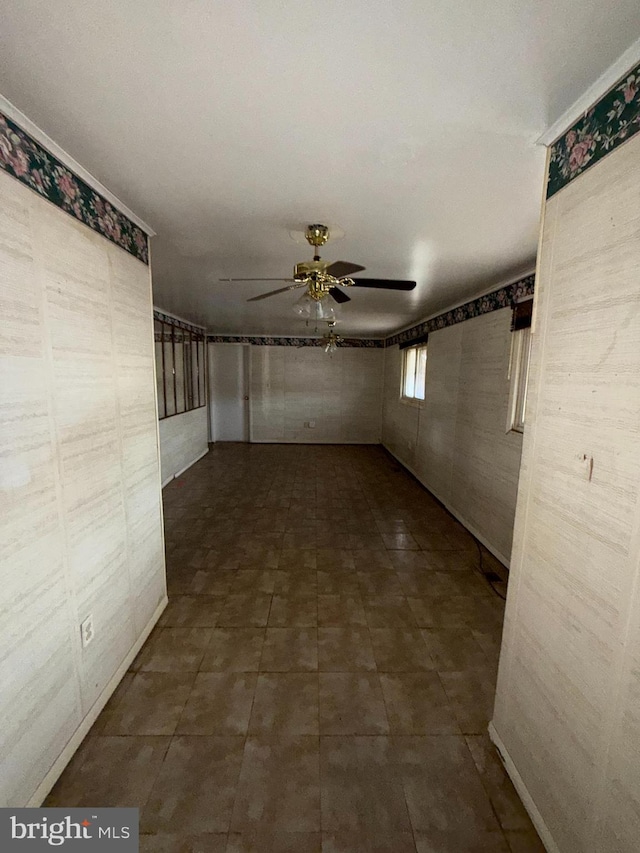 hallway with dark tile patterned floors