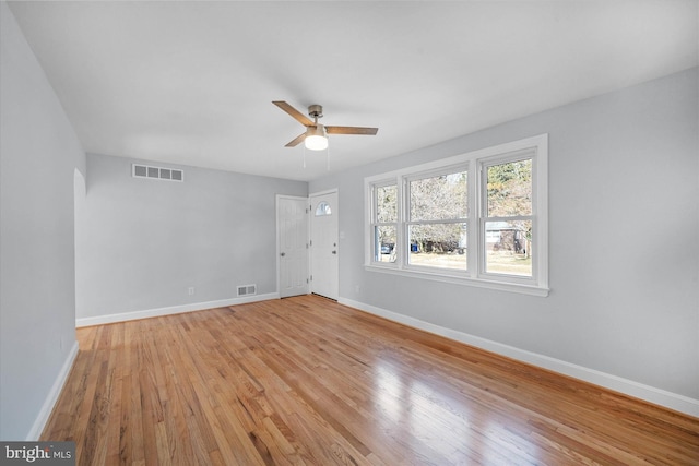 unfurnished room featuring ceiling fan and light hardwood / wood-style flooring