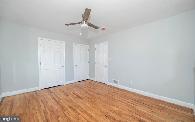 unfurnished bedroom featuring ceiling fan and light wood-type flooring