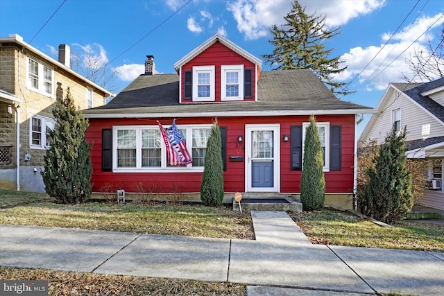 bungalow with a front lawn