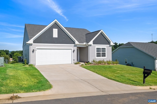 view of front of house featuring a garage, a front yard, and central AC unit