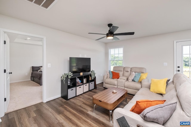 living room featuring ceiling fan, hardwood / wood-style flooring, and a healthy amount of sunlight