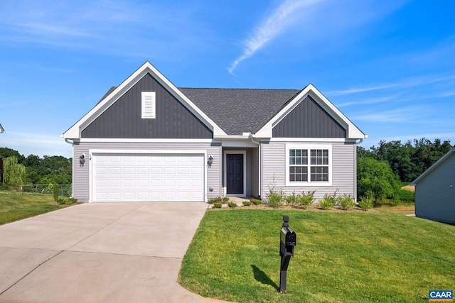 view of front of property with a garage and a front lawn