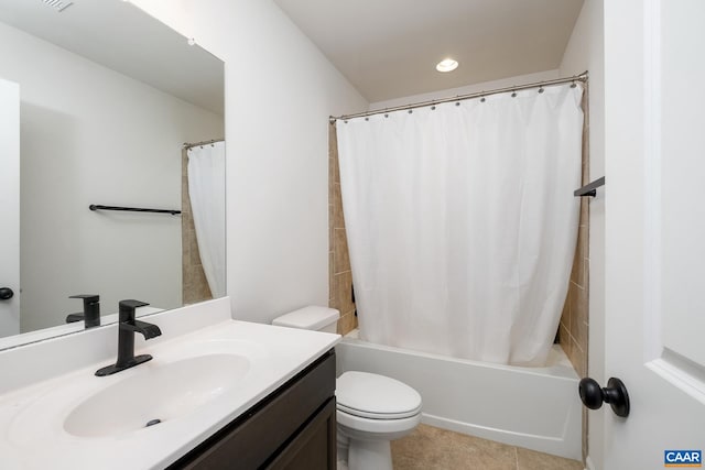 full bathroom with tile patterned flooring, vanity, shower / bathtub combination with curtain, and toilet