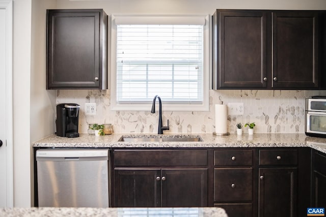 kitchen featuring tasteful backsplash, sink, dark brown cabinetry, and dishwasher