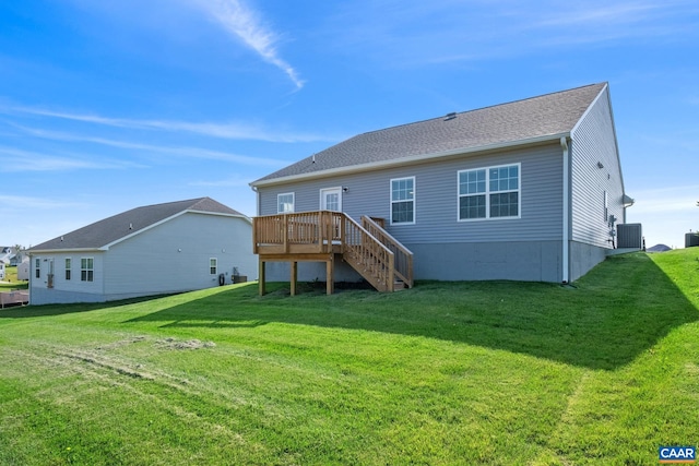 back of house with a yard, a deck, and central air condition unit