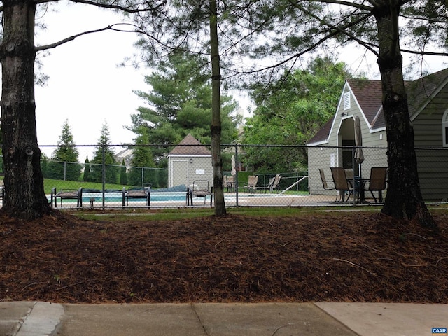 surrounding community featuring tennis court