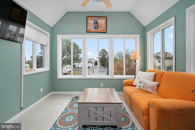 sunroom / solarium featuring lofted ceiling, a wealth of natural light, and ceiling fan