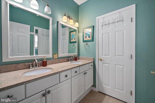 bathroom featuring tile patterned flooring and vanity