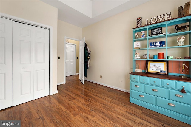 10434 New Quay Rd, Ocean City, MD 21842 - unfurnished bedroom featuring a closet, dark wood-style floors, and baseboards