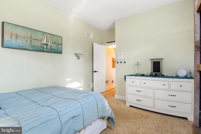 bedroom featuring light colored carpet