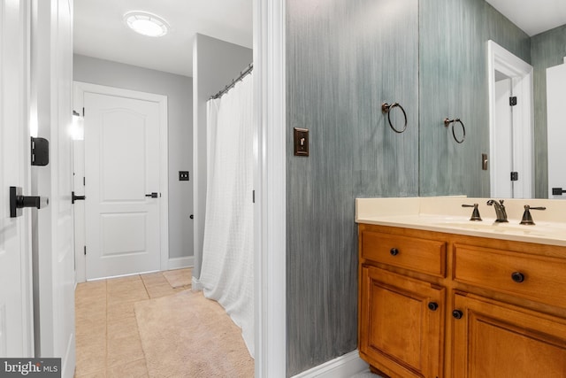 bathroom featuring tile patterned flooring and vanity