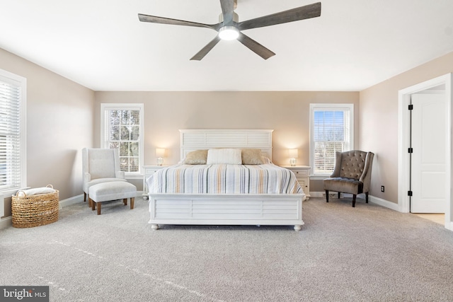 bedroom with ceiling fan and light colored carpet