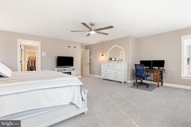 bedroom featuring light carpet and ceiling fan