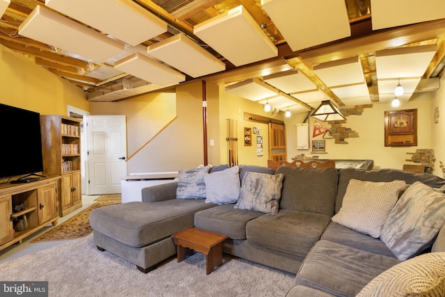 living room with beam ceiling