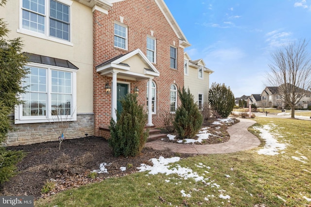 view of property exterior with a yard