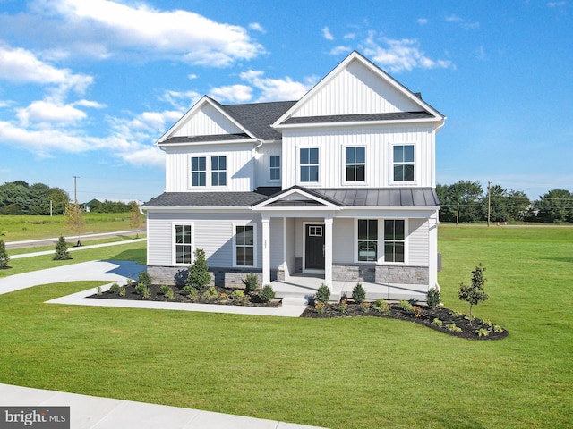 view of front facade with a front lawn and a porch