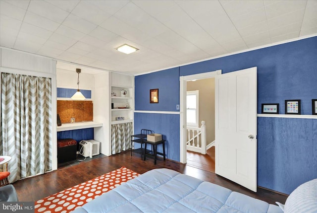 bedroom featuring dark hardwood / wood-style flooring