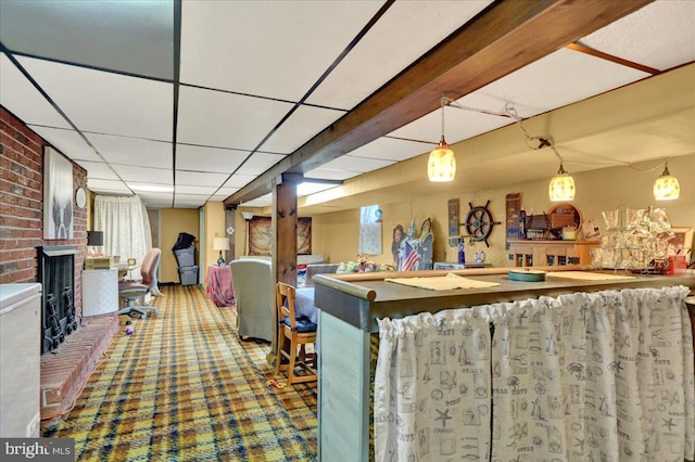 bar featuring decorative light fixtures, carpet floors, beam ceiling, and a drop ceiling