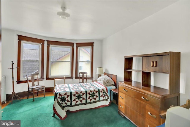 bedroom featuring dark colored carpet