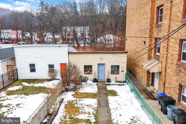 view of snow covered house