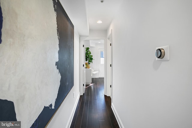 hallway featuring dark hardwood / wood-style flooring