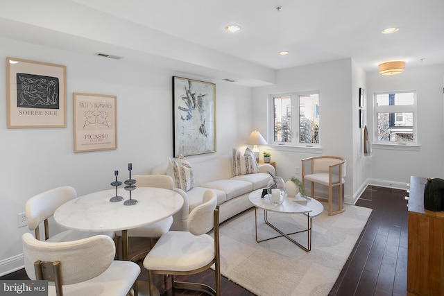 living room featuring recessed lighting, baseboards, visible vents, and dark wood-style flooring