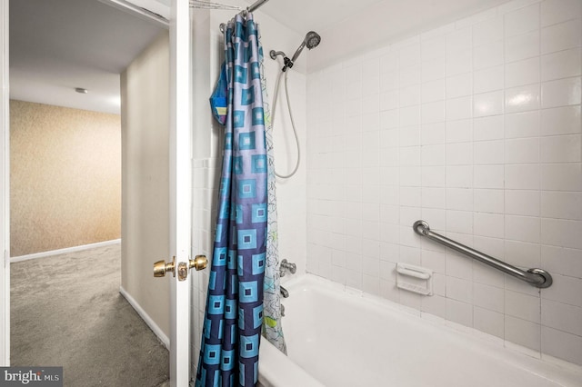 bathroom with shower / tub combo with curtain