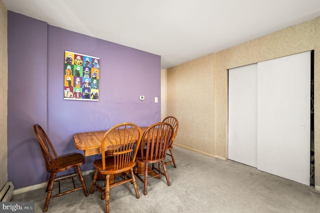 dining room featuring carpet floors and baseboard heating