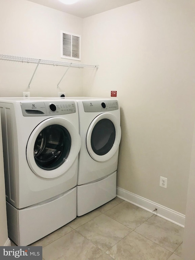 laundry area featuring washer and clothes dryer