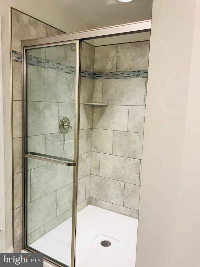 bathroom featuring an enclosed shower