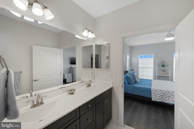 bathroom with vanity, hardwood / wood-style floors, and ceiling fan