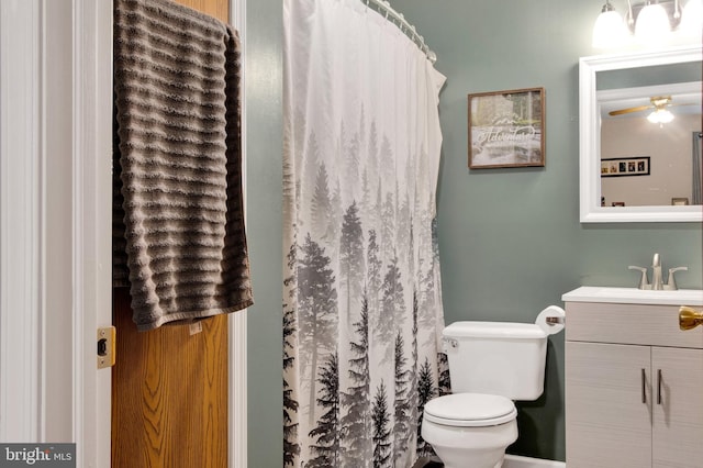 bathroom featuring vanity, ceiling fan, and toilet