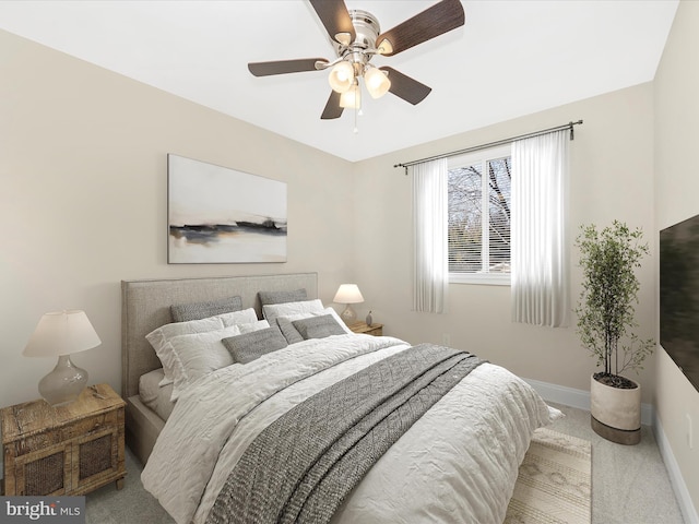 bedroom with carpet, baseboards, and ceiling fan