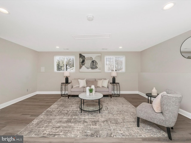 living room with recessed lighting, wood finished floors, and baseboards