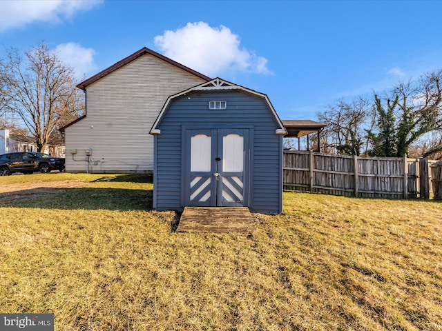 view of shed with fence