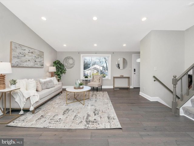 living room featuring baseboards, lofted ceiling, stairway, dark wood-style flooring, and recessed lighting