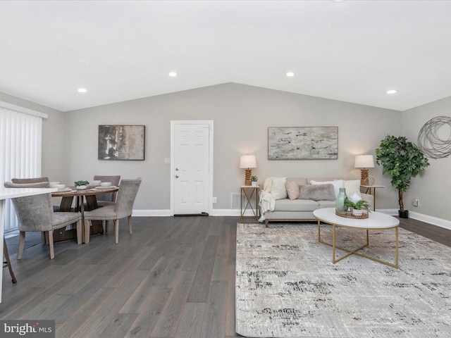 living room featuring lofted ceiling, baseboards, dark wood finished floors, and recessed lighting