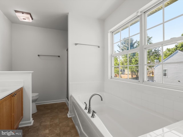 226 Shannonbrook Ln, Frederick, MD 21702 - bathroom featuring a garden tub, vanity, toilet, baseboards, and a shower with door